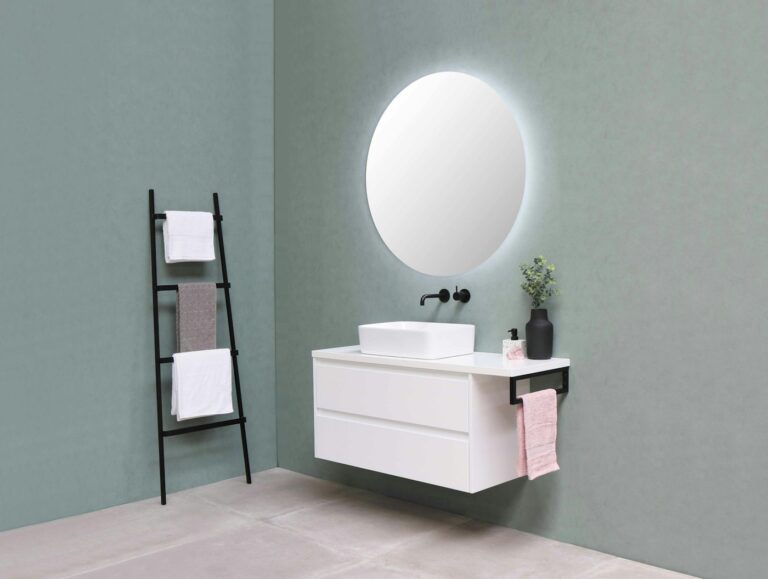 White bathroom vanity with a sink and mirror