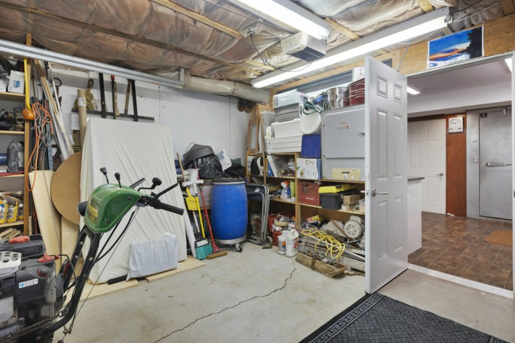 Garage filled with tools and stored items along the walls