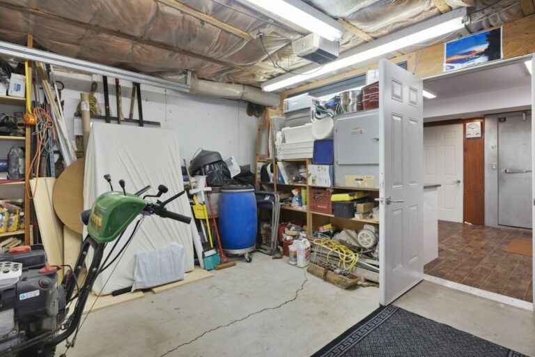 Garage filled with tools and stored items along the walls